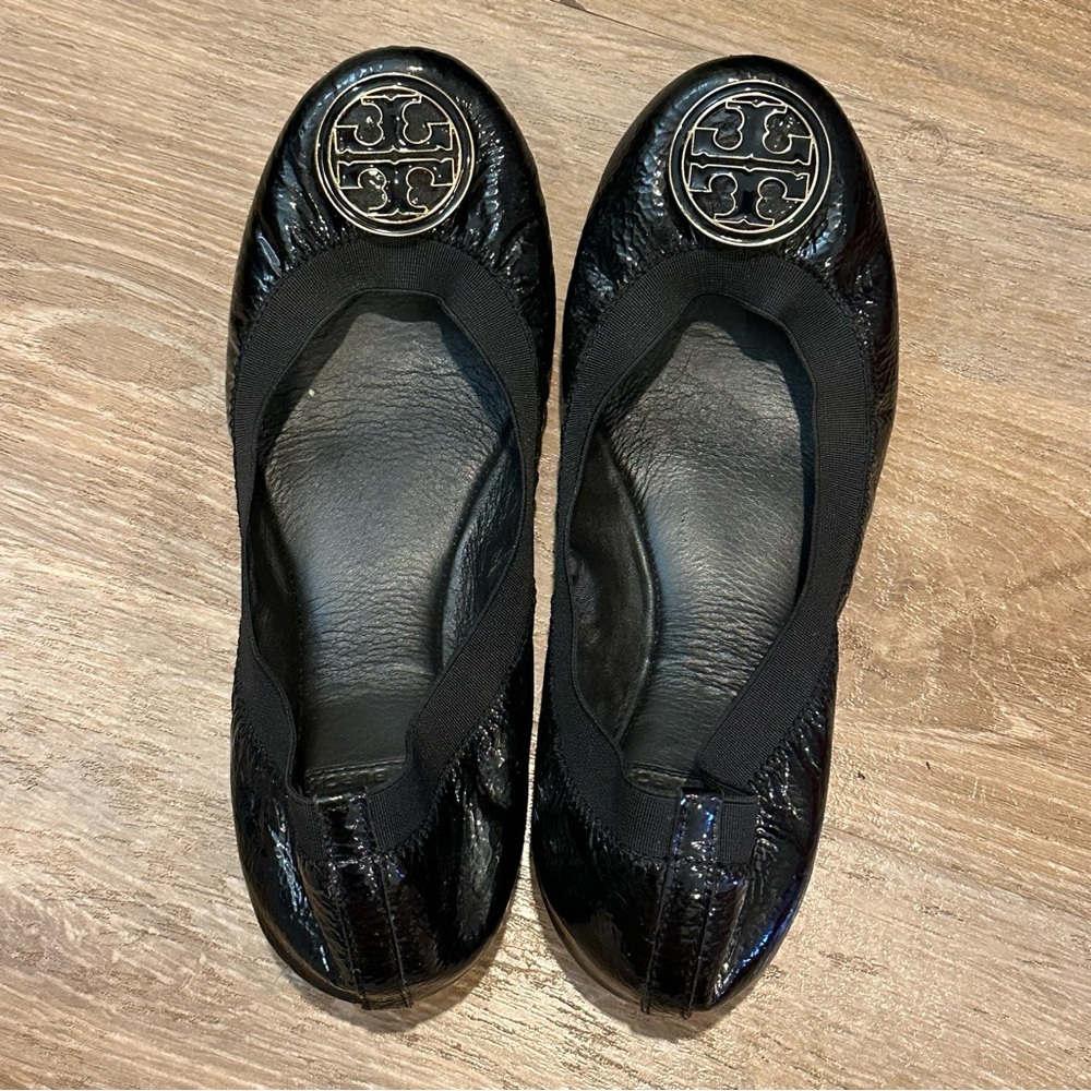 Tory Burch Caroline Black Textured Flats with Metallic Medallion